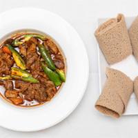 Beef Tibs · Succulent small pieces of beef seasoned with green pepper, onion, tomato and our exotic spic...