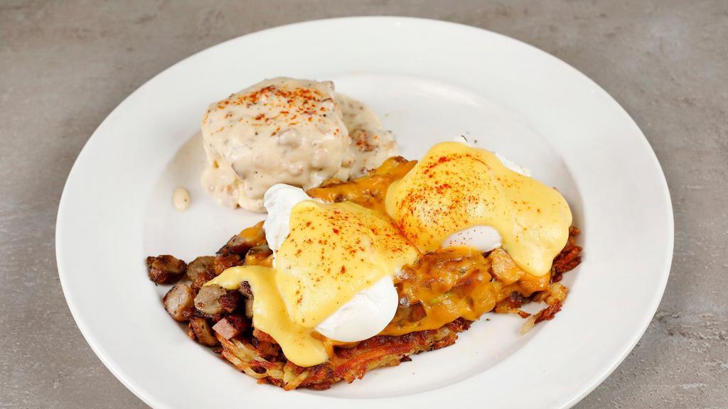 Hash Brown Benedict · Crispy hash browns, two poached eggs, bacon, ham, sausage, cheddar cheese, avocado, hollandaise sauce. Includes a biscuit with gravy.