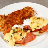 Smoked Salmon Benedict · Toasted muffin, two poached eggs, grilled tomatoes, lox, hollandaise sauce, capers. Includes...
