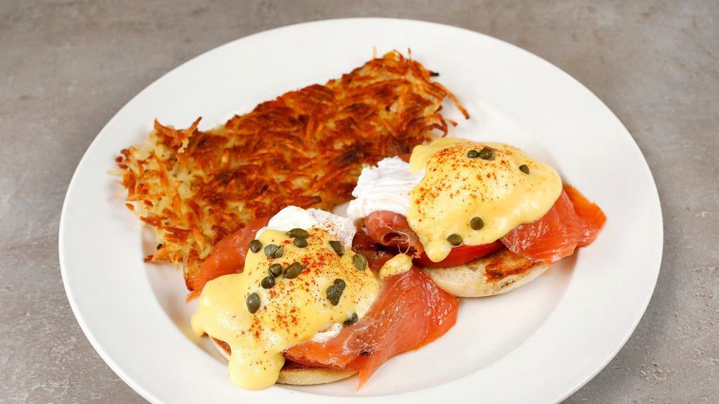 Smoked Salmon Benedict · Toasted muffin, two poached eggs, grilled tomatoes, lox, hollandaise sauce, capers. Includes choice of seasoned country potatoes or hash browns.