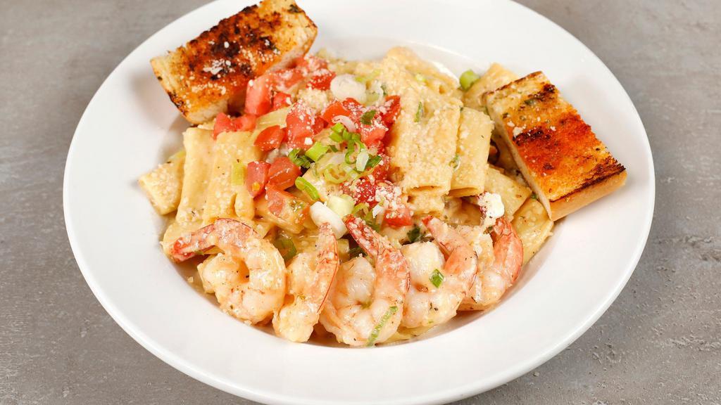 California Pasta · Plump juicy tiger prawns sautéed with Cajun spices, green onions and mushrooms. Tossed with rigatoni pasta, tomatoes, Cajun alfredo sauce and parmesan cheese. Served with garlic bread.
