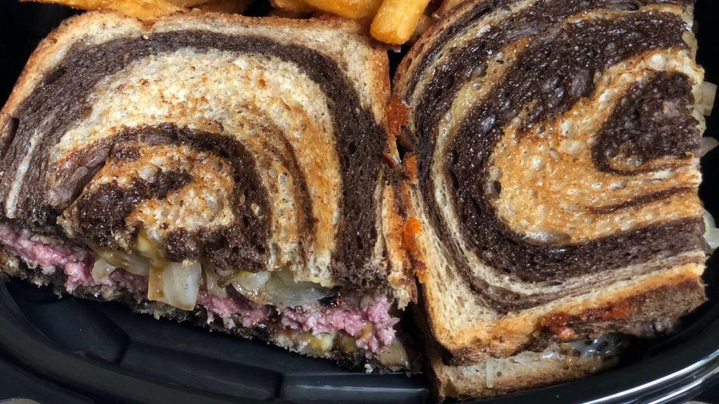 Patty Melt · Certified Angus patty, caramelized onions, American cheese, grilled marble rye bread.