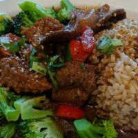 Stew Over Brown Rice · Broccoli, red bell pepper ,tomato, soy protein, cilantro,  served with brown rice.