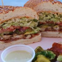 13. Club Sandwich  (Turkey, Grilled Chicken or Chipotle Chicken) · Avocado and bacon. Cajun mayo, Yellow mustard, lettuce, tomato, red onion and pickles.