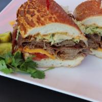 20. BBQ Tri-Tip Sandwich · Choose any two types of meat. Cajun mayo, Yellow mustard, lettuce, tomato, red onion, and pi...