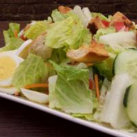 Garden Salad · Romaine lettuce, cherry tomatoes, carrots, cucumbers and egg.