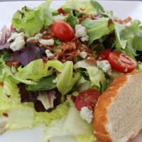 Wedge Salad · Romaine lettuce, cherry tomatoes, bacon and bleu cheese crumbles.