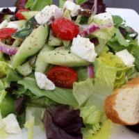Greek Salad · Romaine lettuce, cherry tomatoes, red onions, cucumbers, Kalamata olives and feta cheese.