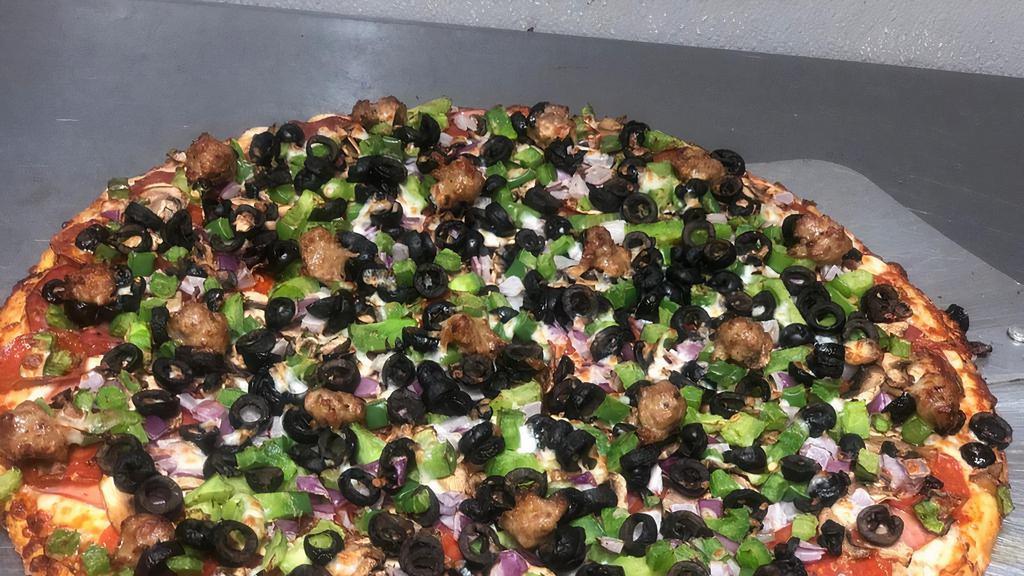 Combination Pizza · Pepperoni, ham, sausage, salami, fresh onions mushrooms and black olives, green peppers mozzarella and tomato sauce.