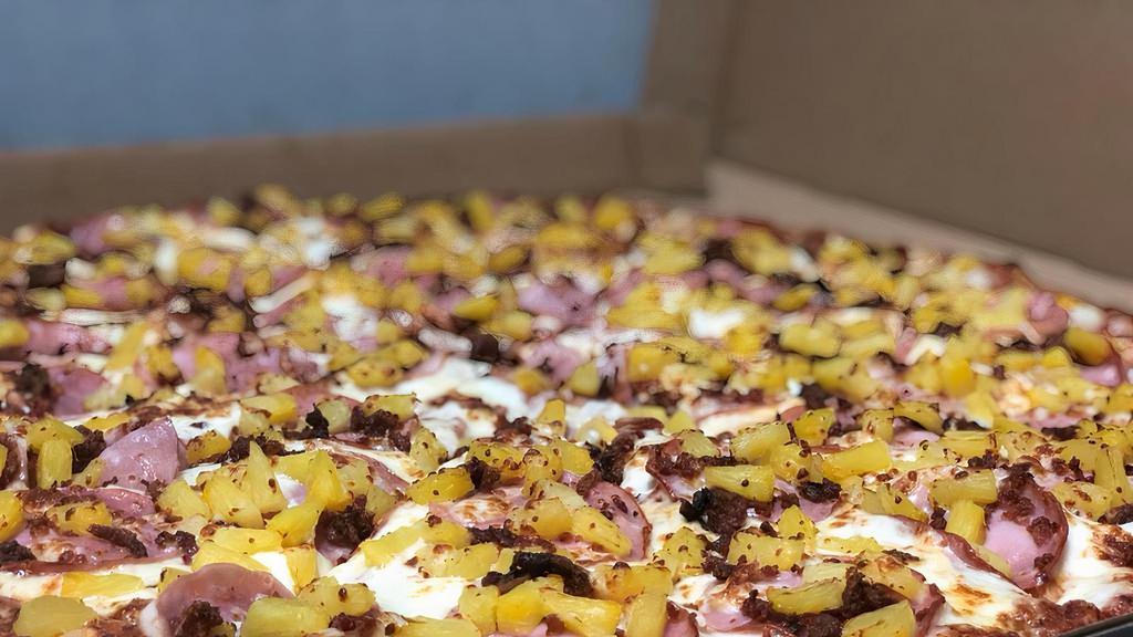 Classic Hawaiian Pizza · Ham, bacon, pineapple, mozzarella, cheese, tomato sauce.
