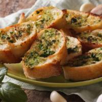 Indian Garlic Bread · A cross between garlic bread and pizza, cheesy bread is a quick, easy, and delicious party s...