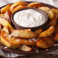 Potato Wedges · Wedges of sweet potatoes, tossed with oil, sprinkled with spices, and baked on high heat unt...