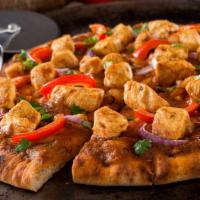 Apna Butter Chicken Pizza · Butter chicken sauce, mushrooms, red onions, bell peppers, tomatoes, chicken and mozzarella ...