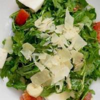 Trecciolina · Fresh Organic arugula, hearts of palm, tomatoes, shaved Parmigiano Reggiano cheese, mozzarel...
