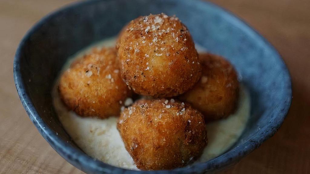 Croquette · Homemade Potato croquette with Gruyere cheese, Parmesan cheese, leeks,  parsley, . served with truffle fondue