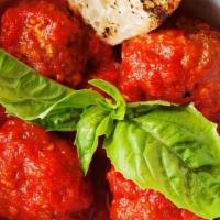 Polpettine · Neapolitan style meatballs (beef, sausage). in a spicy tomato sauce, . Served with grilled b...
