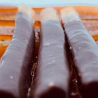 Orange & Chocolate Sicks · Candied Orange Sticks Coated dipped in Araguani 72% Chocolate.
Qty. 6 (2 oz)