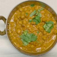 Channa Masala · Vegan. Protein rich garbanzo beans with onions, tomatoes, and tamarind sauce.