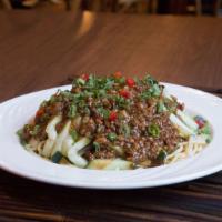 Meat Sauce over Noodles · Rich and savory pork meat sauce with your choice of either cucumbers or cabbage over noodles.