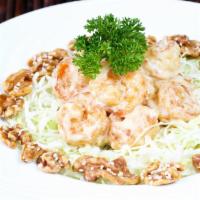 Honey Walnut Prawns · Fried prawns enveloped in a creamy sauce and served with house-made honey walnuts.