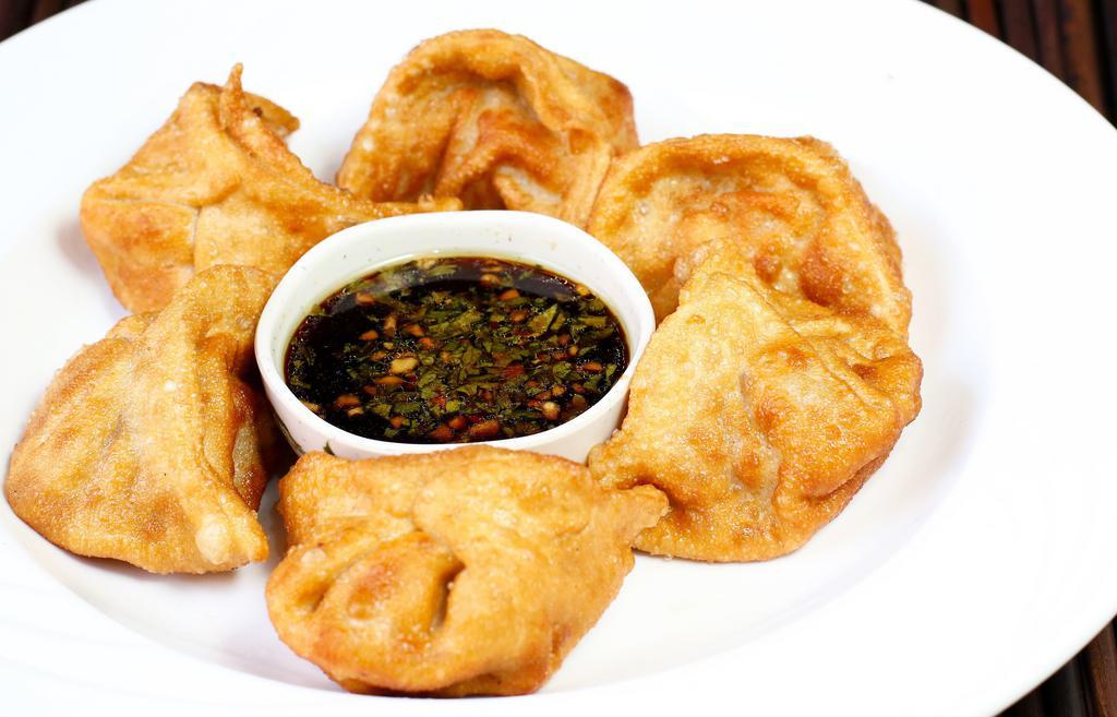 Steamed/Fried Dumplings · Steamed or deep fried dumplings with a filling of pork, vegetables, ginger, and garlic. Served with your choice of sauce.