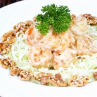 Honey Walnut Prawns · Fried prawns enveloped in a creamy sauce and served with house made honey walnuts.