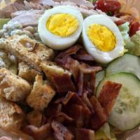 Artisan Chopped Salad · Romaine, roasted chicken, maple bacon, cherry tomato, cucumbers, sliced egg, blue cheese cru...