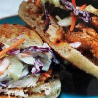 Fried Buttermilk Chicken · With chipotle coleslaw on a French roll.