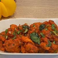  Chicken 65 · Boneless chicken cubes marinated and tossed in spiced yogurt and curry leaves.