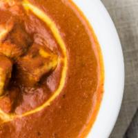 Paneer Butter Masala · Indian cottage cheese cooked in creamy tomato sauce.