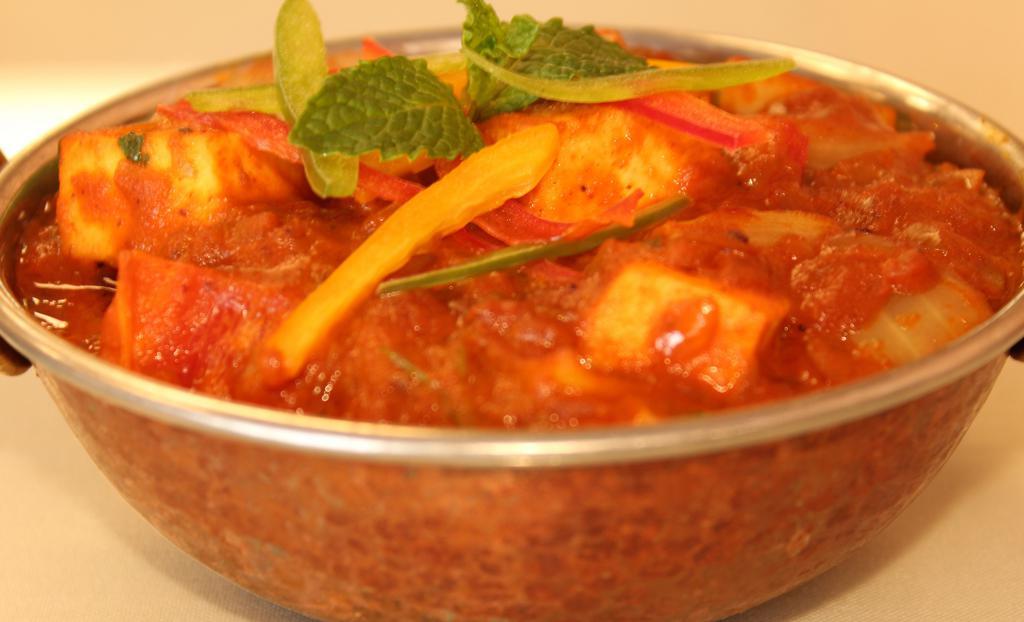 Kadai Paneer · Indian cottage cheese sautéed with colorful bell peppers, onions, and tomato gravy.