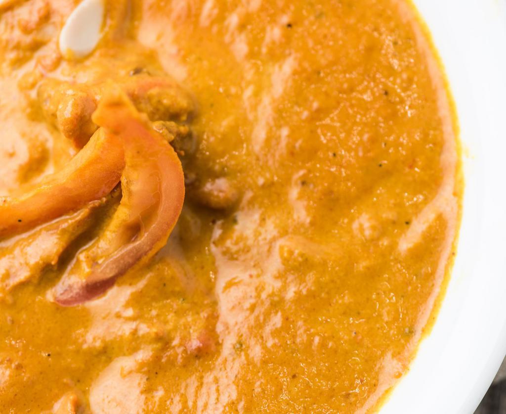 Butter Chicken · Boneless tandoori chicken cooked in a luscious blend of cream and tomato sauce.
