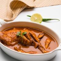 Chicken Curry · Cubes of succulent chicken cooked in a traditional brown gravy with herbs and spices.