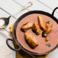 Fish Curry · Cut fillets of tilapia cooked in a traditional curry sauce with a hint of tomatoes and tamar...