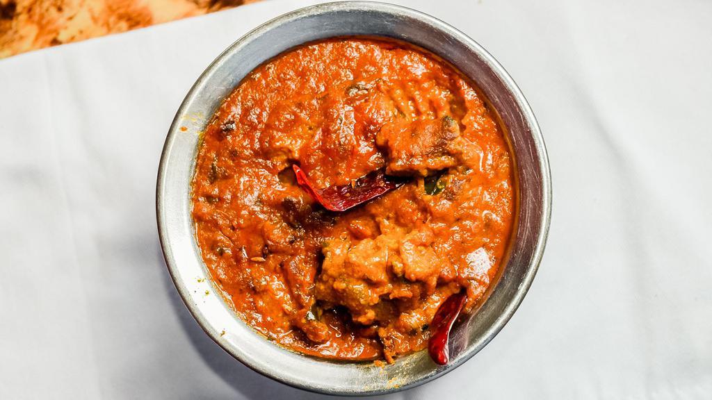 Lamb Curry · Boneless lamb cubes cooked in traditional curry sauce, also available with spinach or in the goan style with potatoes.