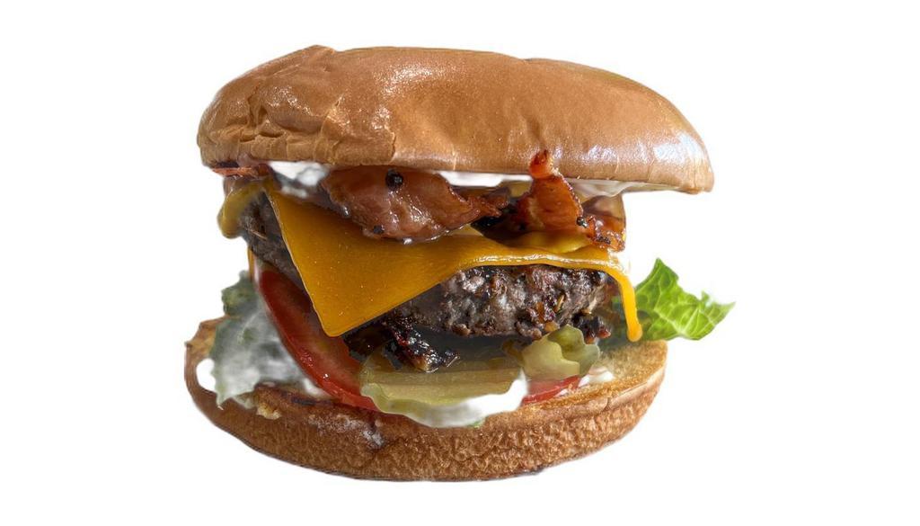 Bacon Hamburger · 1/3 lb Burger with bacon, lettuce, tomato, pickle, and onion. Served with French Fries