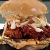 Nashville Hot Chicken · Buttermilk chicken thigh, served on a potato roll with comeback sauce and pickles.