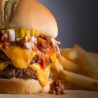 The Lava Burger - Combo  · Two beef patties stuffed with cheddar cheese on a bun topped with pickles, onions, ketchup a...