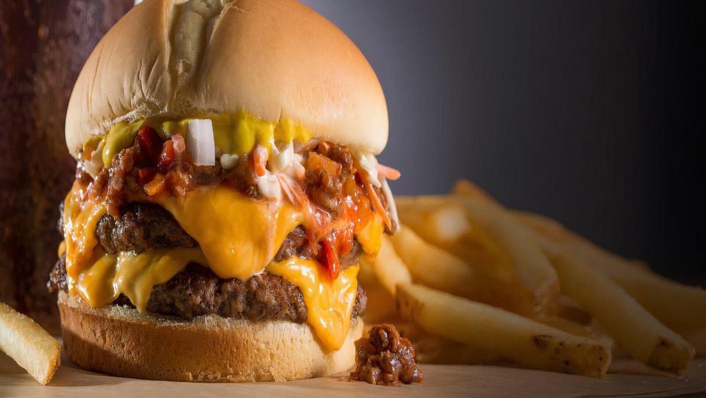 The Lava Burger - Combo  · Two beef patties stuffed with cheddar cheese on a bun topped with pickles, onions, ketchup and mayo. Includes large French Fries and choice of large drink