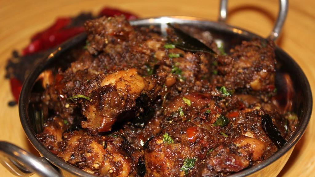 Pepper Chicken · Boneless chicken marinated with spices tossed with menchurian sauce and pepper powder.
