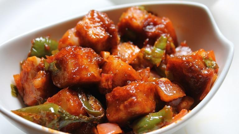 Chili Paneer · Deep fried Indian cottage cheese cubes cooked in special sauce & sauteed with onions and green chillies.
