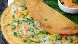 Cheese Dosa · A crispy crepe topped w/grated jack & cheddar cheese.