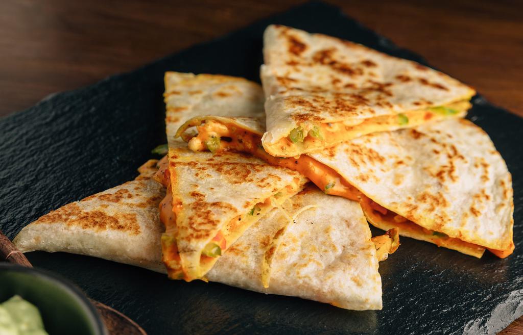 Breakfast  Quesadilla · Famous It’s a Grind Quesadillas filled with your choice of meat, eggs, shredded cheese, veggies