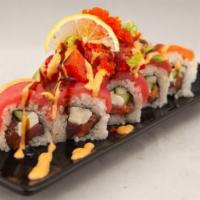 Sushi Boy · In: salmon, avocado, ream cheese roll. Top: salmon, tuna, chopped spicy tuna, tobiko with sp...