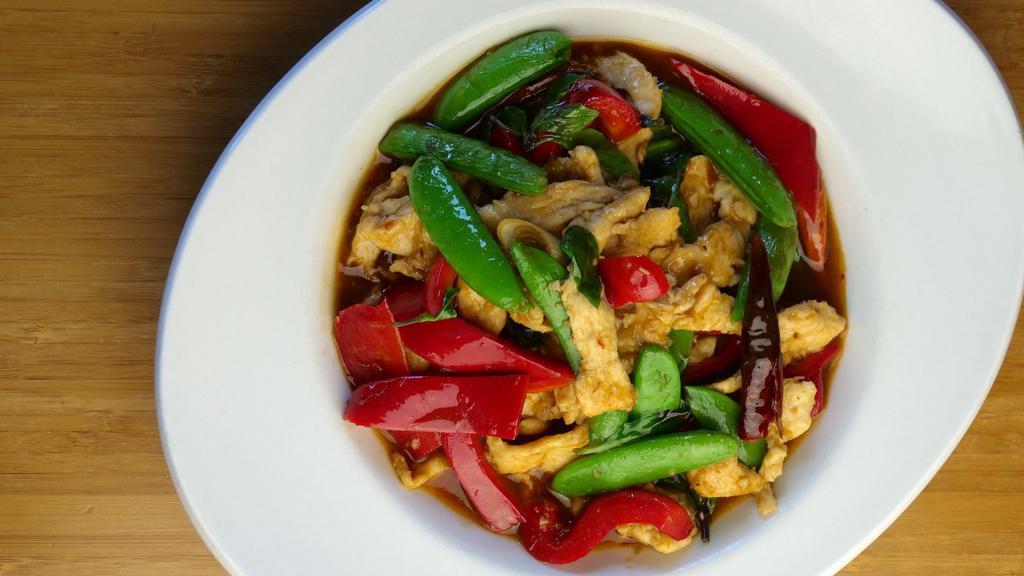 Rangoon Lemongrass Chicken · Chili, garlic, soy sauce, fish sauce, green beans, red bell peppers, lemongrass and chicken breast tossed in a wok and finished with fresh basil.
