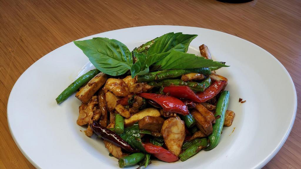 Fiery Chicken Tofu · Chicken breast fried in a wok with tofu, string beans, bell pepper, and basil in a sweet and spicy sauce.