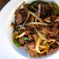 Basil Chili Beef · Strips of beef tossed with dried red chili flakes, fresh chili, onions, and finished with ba...