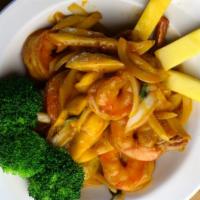 Mango Shrimp · Juicy shrimp tossed in a wok with basil, onions, chili and mango puree. Served with fresh ma...