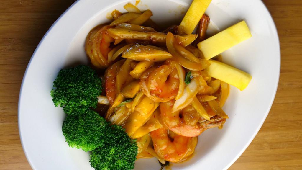 Mango Shrimp · Juicy shrimp tossed in a wok with basil, onions, chili and mango puree. Served with fresh mango on the side.