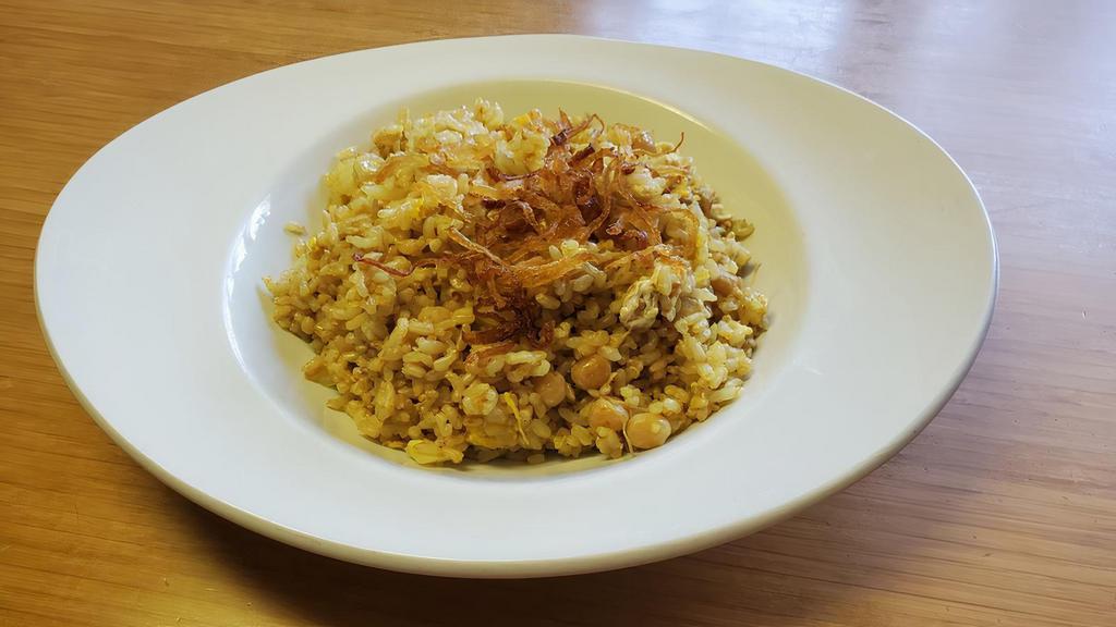 Burmese Style Fried Rice · Tender whole yellow beans steamed for hours with fried jasmine rice, onion and egg, topped with fried onions.